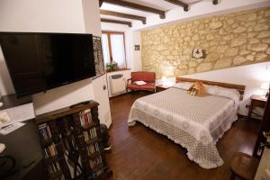 Postel nebo postele na pokoji v ubytování La Casa In Pietra