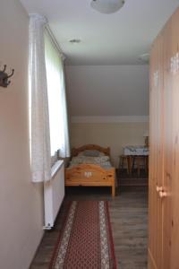 Łóżko lub łóżka w pokoju w obiekcie Pokoje Gościnne u Joli
