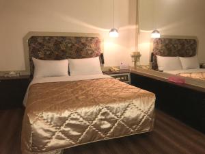Ein Bett oder Betten in einem Zimmer der Unterkunft 真正好旅店 Good Hotel