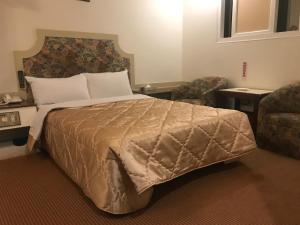 Ein Bett oder Betten in einem Zimmer der Unterkunft 真正好旅店 Good Hotel