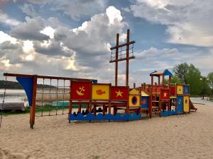 a playground in the sand on a beach at Willa Kormoran in Augustów