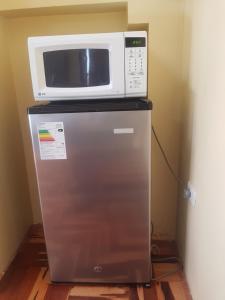 Kuchyň nebo kuchyňský kout v ubytování Hostal Wasichay