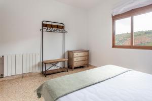 Posteľ alebo postele v izbe v ubytovaní RUSTIKALPUENTE Casa del MEDICO
