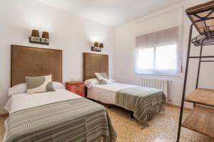 Postel nebo postele na pokoji v ubytování RUSTIKALPUENTE Casa del MEDICO