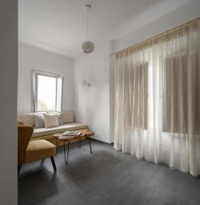 Postel nebo postele na pokoji v ubytování Elitoz Suites