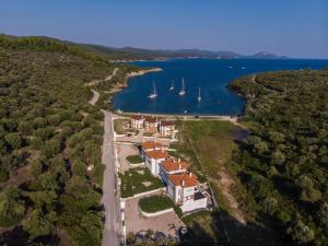 an aerial view of a house with boats in the water at PORTO AZZURO SITHONIA GREECE in Neos Marmaras