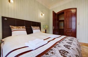 Ένα ή περισσότερα κρεβάτια σε δωμάτιο στο Tessa Jagiellońska