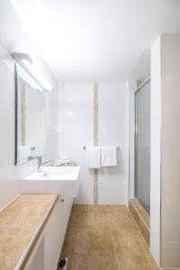 a bathroom with a sink, toilet, and bathtub at Great Southern Hotel Brisbane in Brisbane
