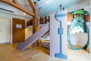 Postelja oz. postelje v sobi nastanitve 松楓親子民宿Songfeng Family B&B