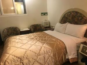 Ein Bett oder Betten in einem Zimmer der Unterkunft 真正好旅店 Good Hotel