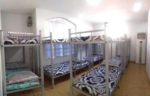 Postel nebo postele na pokoji v ubytování Mang Ben Dormitory