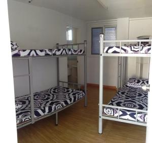 Postel nebo postele na pokoji v ubytování Mang Ben Dormitory