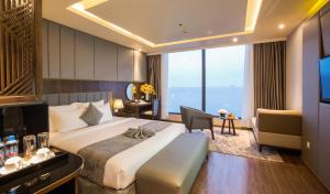 Un ou plusieurs lits dans un hébergement de l'établissement DTX Hotel Nha Trang