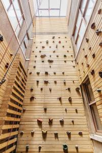 an indoor climbing wall in a building with a climbing wall at Bao Cheng Home in Tainan
