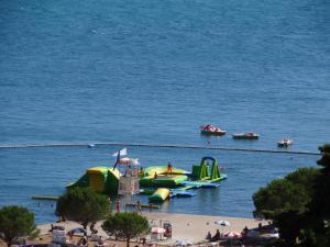 a group of boats in the water at a beach at Pension Silvia in Portorož