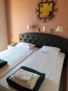 Postel nebo postele na pokoji v ubytování Plaza Hotel