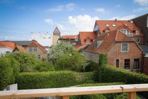 a view of a city with houses and bushes at moevDECK in Heiligenhafen