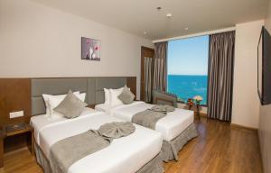 Un ou plusieurs lits dans un hébergement de l'établissement DTX Hotel Nha Trang