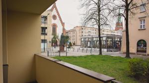 a view of a city street with a church at Mieszkanie przy Rynku in Racibórz