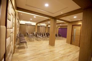 a conference room with chairs and tables in it at Silverador Boutique Hotel in Thane