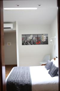 Postel nebo postele na pokoji v ubytování Priorat Boutique