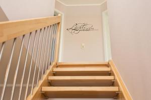 a staircase in a house with a sign on the wall at Ferienhaus Buche im Land Fleesensee in Göhren-Lebbin