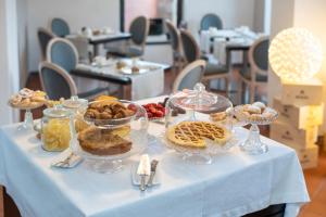 a table with several dishes of food on it at Locanda La Fortezza in Finale Ligure