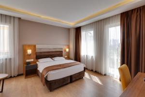 Кровать или кровати в номере City Hotel Batumi