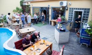 a group of people sitting at tables at a restaurant at Station - Hostel for Backpackers in Cologne