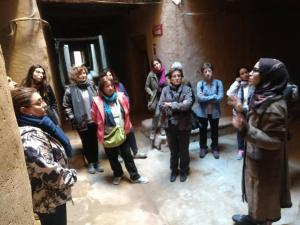 a group of people standing in a room at Gite Elkhorbat in Tinejdad