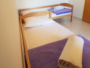 Postel nebo postele na pokoji v ubytování Apartments Margita