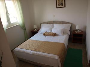 Postel nebo postele na pokoji v ubytování Villa Fendi