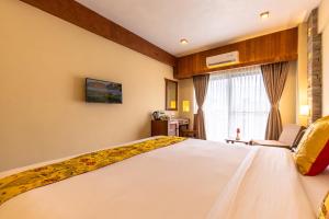 Letto o letti in una camera di Hotel Mala Pokhara