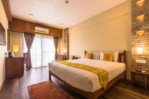 Letto o letti in una camera di Hotel Mala Pokhara