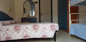 Postel nebo postele na pokoji v ubytování B&B Villa Rocchi