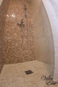 a shower with a shower head in a bathroom at Villa Eva in Gradac +34 photos