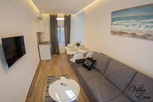a living room with a couch and a table at Villa Eva in Gradac
