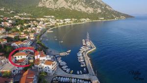 an aerial view of a harbor with boats in the water at Villa Eva in Gradac