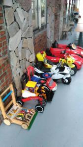 a group of toy motorcycles parked next to a building at Vanilla Twilight in Wujie