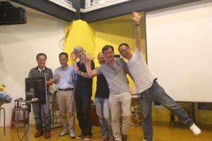a group of men standing in a room with their arms in the air at Vanilla Twilight in Wujie