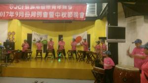 a group of people in pink shirts on a stage at Vanilla Twilight in Wujie