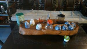 a wooden table with cups and jars on it at Vanilla Twilight in Wujie
