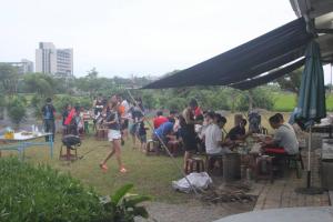 a group of people sitting at tables under a tent at Vanilla Twilight in Wujie