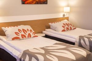 Postel nebo postele na pokoji v ubytování Park Hotel Tornio