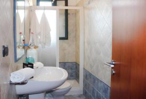 a bathroom with a sink and a toilet at Leuca Villetta Vista Mare in Leuca +21 photos
