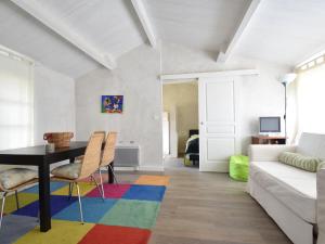 a living room with a table and a couch at Mansion in Charrin by Loire with Pool in Charrin