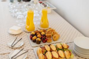 a table with two plates of food and two glasses of orange juice at Hotel LIVVO Volcán Lanzarote in Playa Blanca