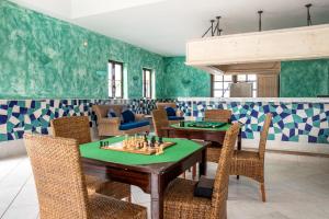 a dining room with a chess board on a table at Hotel LIVVO Volcán Lanzarote in Playa Blanca