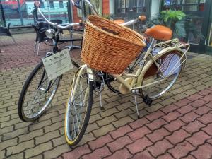 a bicycle with a basket on top of it at Boutique Hotel Mama in Jūrmala