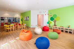 a room with many different colored bean bags on the floor at Hotel LIVVO Volcán Lanzarote in Playa Blanca